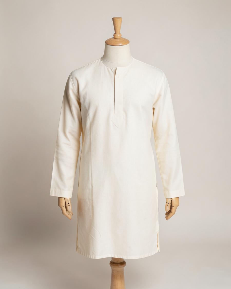 Ivory cotton kurta on a headless tailor mannequin against a plain studio backdrop
